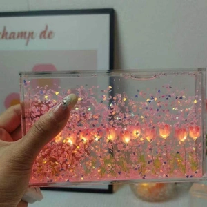 DIY Tulip Quicksand Night Light with pink glitter and glowing flower petals in acrylic box