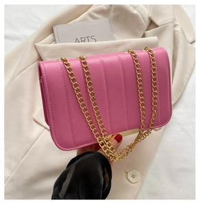 Pink quilted shoulder bag with gold chain strap and elegant metallic accent detail