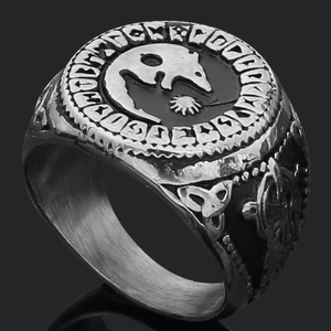Macro view of Viking Thor's Hammer ring with Nordic runes and Celtic knot details