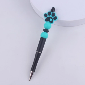 Close-up of DIY beaded pen with blue heart paw charm and silicone beads detail