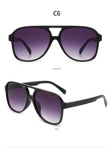 Detail of pilot sunglasses C6 featuring a black frame with purple gradient lenses