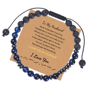 Detail of Morse code bracelet featuring blue tiger eye beads and lava rocks on gift card