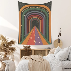 Detail of bohemian rainbow tapestry featuring path and stars in a bedroom setting