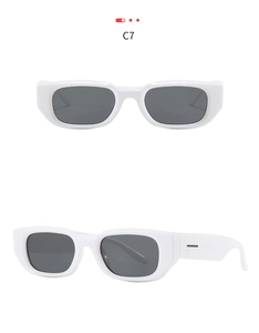 Detail view of white rectangle sunglasses with thick temples and grey lenses