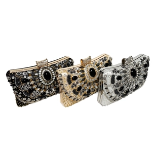 Detail of luxury beaded evening clutches in black, gold, and silver with crystal accents