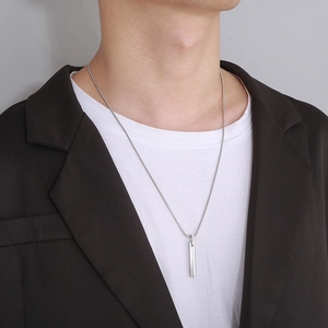 Minimalist silver stainless steel bar pendant necklace on male model with snake chain