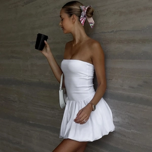 Elegant white strapless mini dress with cinched waist and bubble hem for summer fashion
