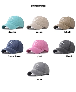 Detailed grid view of washed cotton baseball caps in seven assorted colors with heart embroidery