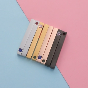 Polished stainless steel bar pendants in silver, gold, and rose gold with inlaid crystals