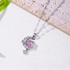 Pink heart and crescent moon pendant necklace in silver finish with pavé crystals
