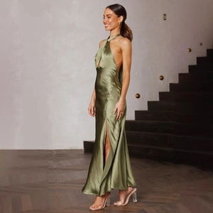 Detailed view of the olive green satin fabric and high slit design of the halter maxi dress