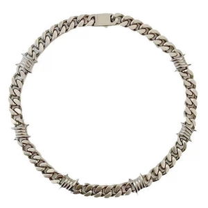 Silver cuban chain necklace with thorn barbed wire accents on white background