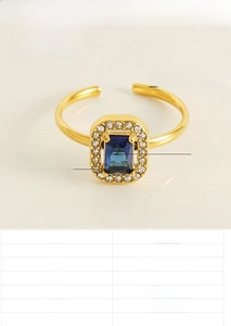 Detail view of double-layer heart ring with blue zircon and 18K gold plated finish