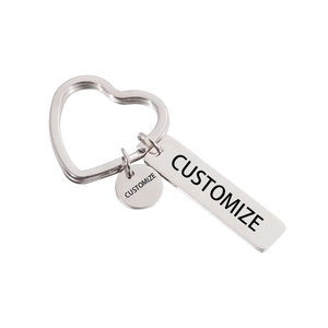 Macro detail of customized stainless steel keychain with heart ring and metal tags