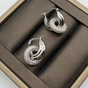 Elegant silver interlocking double hoop earrings with pave cubic zirconia and polished finish