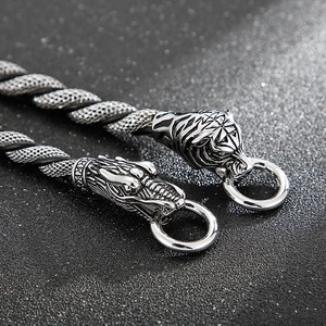 Punk style stainless steel bracelet featuring dragon and tiger head charms with mesh link