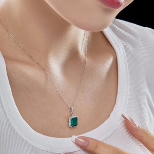 Elegance of S925 sterling silver necklace with rectangle green zircon on female model