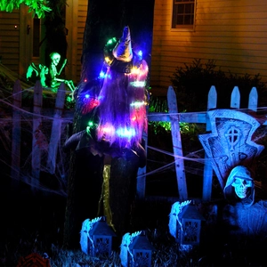 Glowing Halloween tree-crashing witch with purple hair and LED lights for yard decor