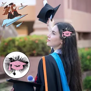 Pink graduation cap hair clip with glitter powder, black mesh and star accents