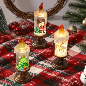 Trois bougies LED de Noël avec figurines du Père Noël et d'ange sur socles en bronze vintage