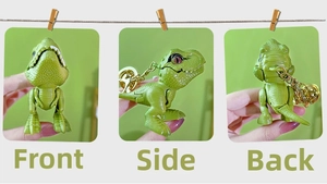 Green T-Rex dinosaur keychain shown from front, side, and back with gold bell detail