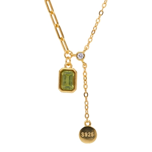 S925 silver gold plated necklace with green rectangular gemstone on a white background