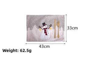 Detailed view of Christmas table mat with snowman design and 43x33cm size specifications