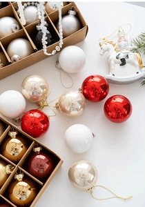 Top view of premium 6cm gold, silver and red Christmas glass ornaments in a gift box