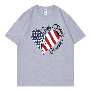 Close-up of heart graphic with USA flag pattern and text on a grey cotton t-shirt