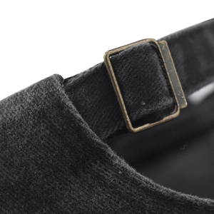 Macro view of adjustable copper buckle and vintage washed fabric on baseball cap