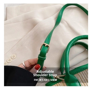Detail view of woven bucket bag featuring adjustable green leather strap and gold buckle
