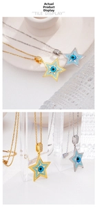 Detailed view of gold and silver star pendants featuring evil eye designs with cubic zirconia