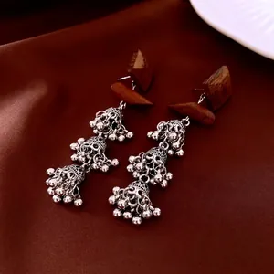 Ethnic bohemian style square wood drop earrings with silver metallic bell tassels