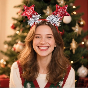 Close-up of festive red Christmas headband with snowflake stars worn by a smiling model