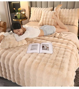 Detail of premium beige faux rabbit fur blanket and pillowcase with thick waffle texture