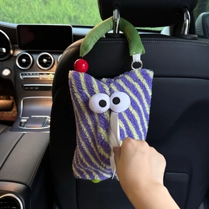 Car tissue holder in purple stripe monster plush design hanging on black leather seat