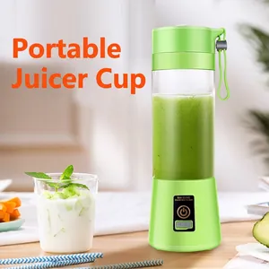 Portable mini electric fruit juicer cup with wireless rechargeable base in green