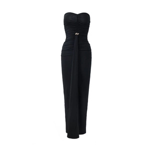 Detail of ruched black strapless dress featuring a decorative gold buckle at the waistline