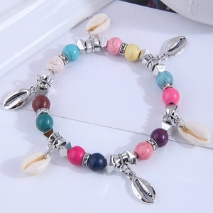 Bohemian multicolored beaded bracelet with turquoise and natural shell charms