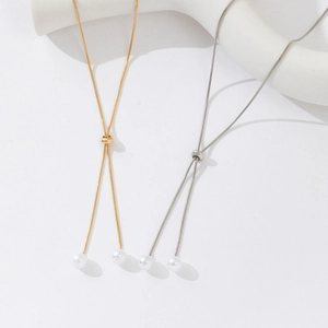 Adjustable long pearl necklace with gold and silver finishes and slide buckle detail