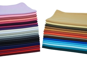Macro view of multi-color soft jersey fabric layers for warm African style shawls