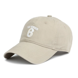 Detail of THE NUMBER 6 white embroidery on beige cotton twill baseball cap