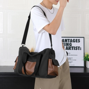 Men's large capacity travel tote bag in black canvas and brown leather for daily commuting