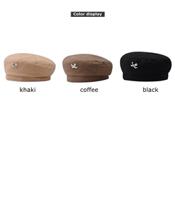 Wool beret color display in khaki, coffee, and black with metallic X detail