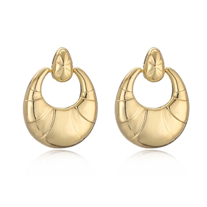 Minimalist gold-plated crescent earrings with star stud detail on white background