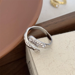 Detailed macro view of 925 silver irregular ring with sparkling zircon embellishments