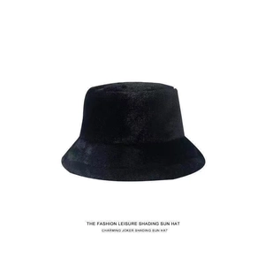 Close-up of black faux rabbit fur bucket hat showing soft plush texture and warm material