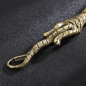 Macro shot of vintage bronze tiger bone link bracelet with antique metal texture and clasp