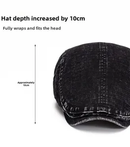 Detail view of washed black denim beret hat with a 10cm deep fit and vintage texture
