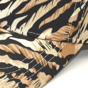 Close-up of animal print baseball cap showing durable stitching and twill fabric